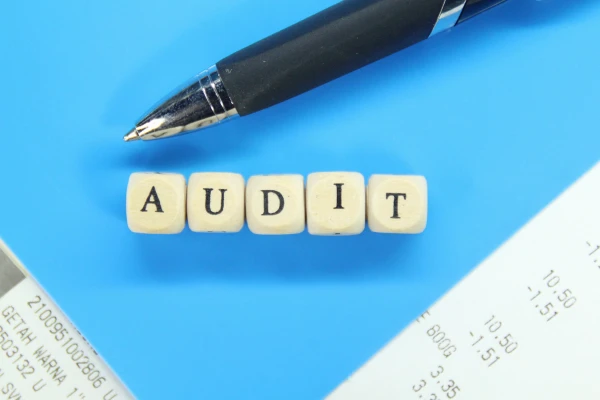 Photo of AUDIT spelling out with scrabble blocks