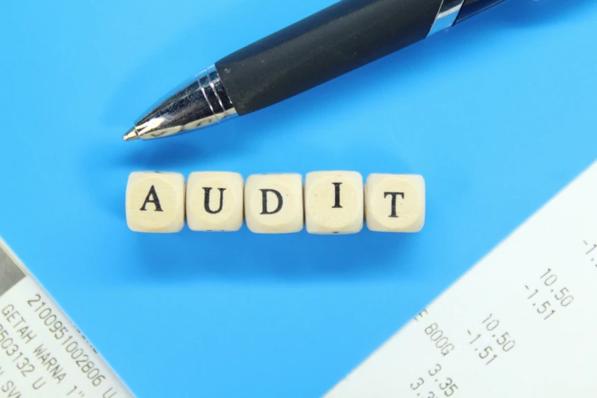 Photo of AUDIT spelling out with scrabble blocks