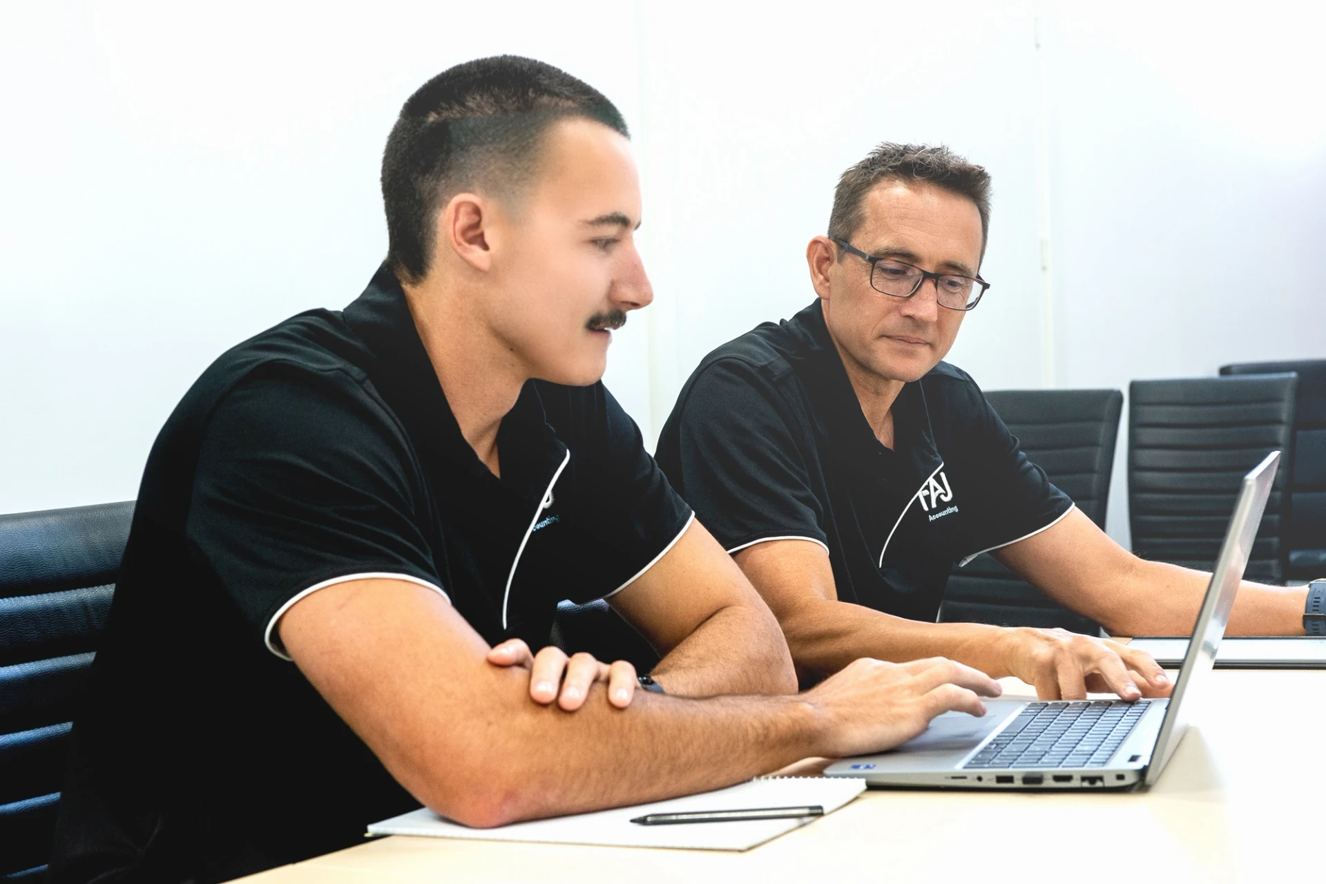 Image of FAJ staff going over a clients documents